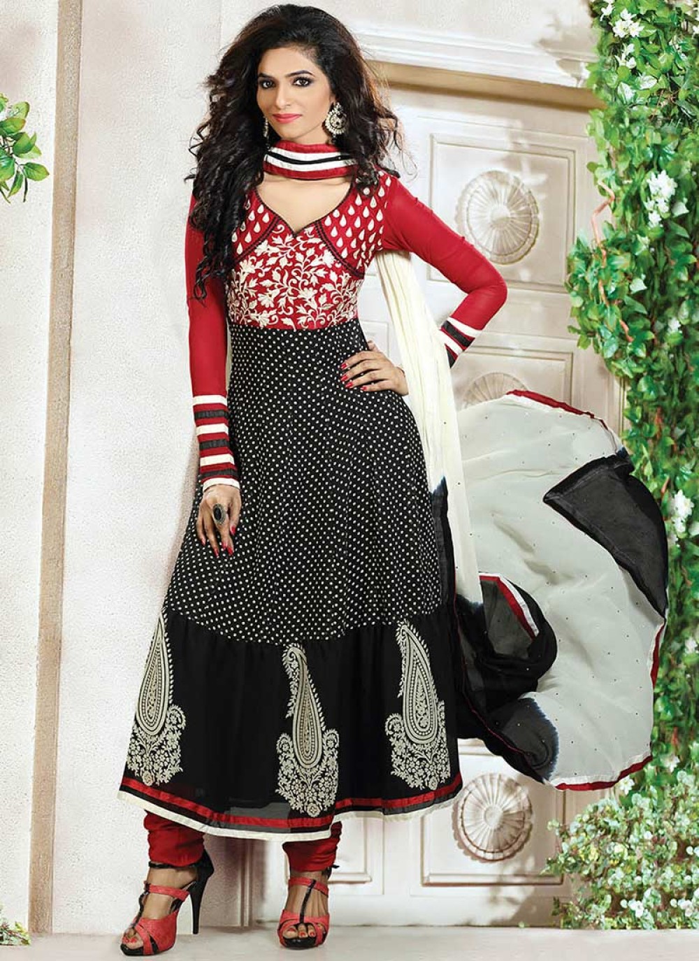 Evocative Black And Red Printed Tiered Churidar Suit
