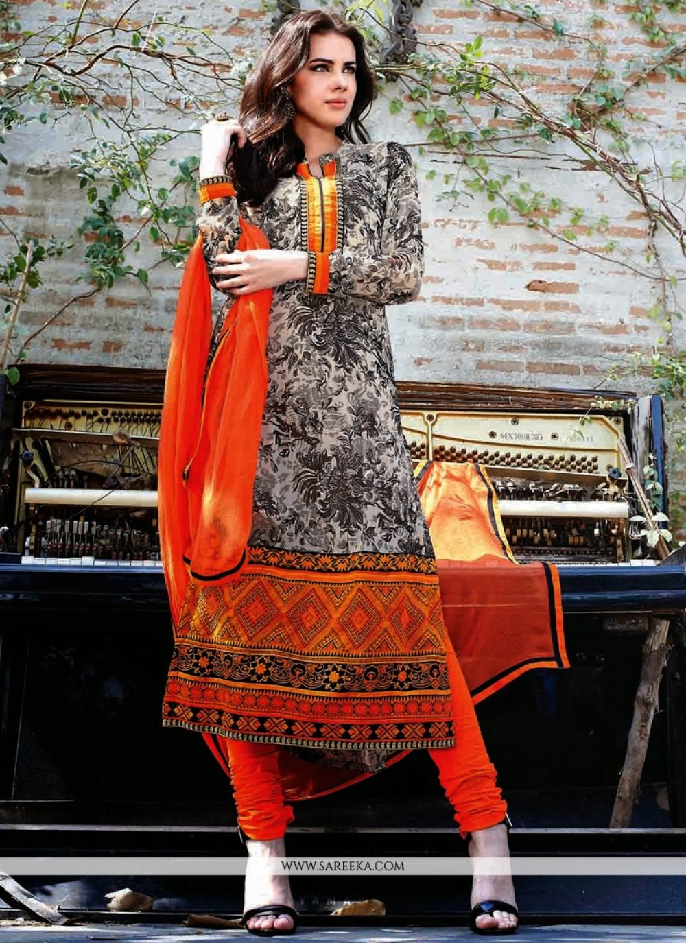 Off White And Orange Georgette Churidar Suit