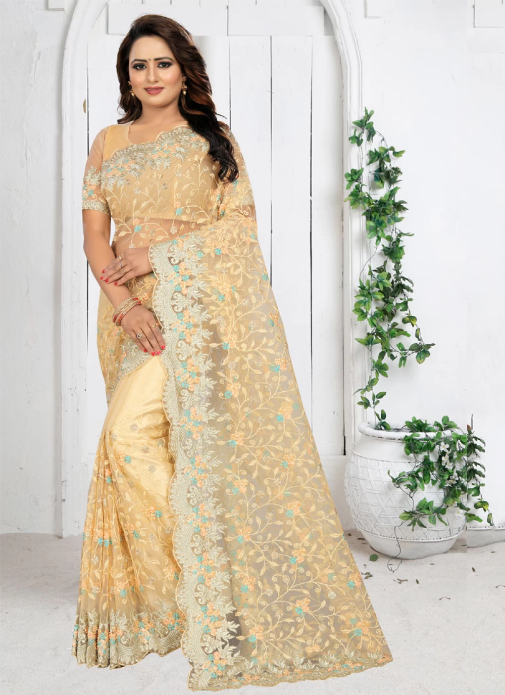 cream colour net saree