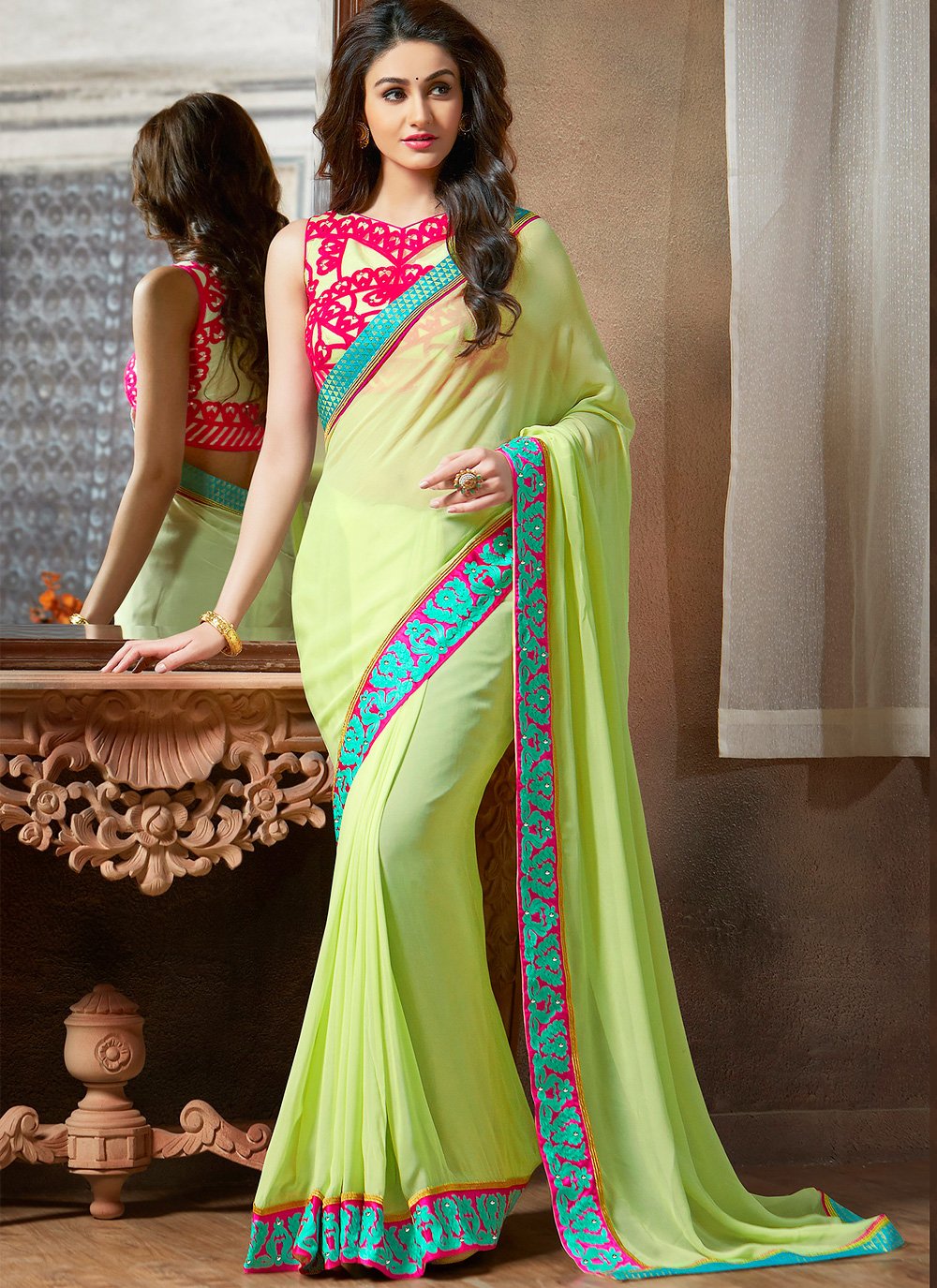 Faux Georgette Embroidered Saree in Green