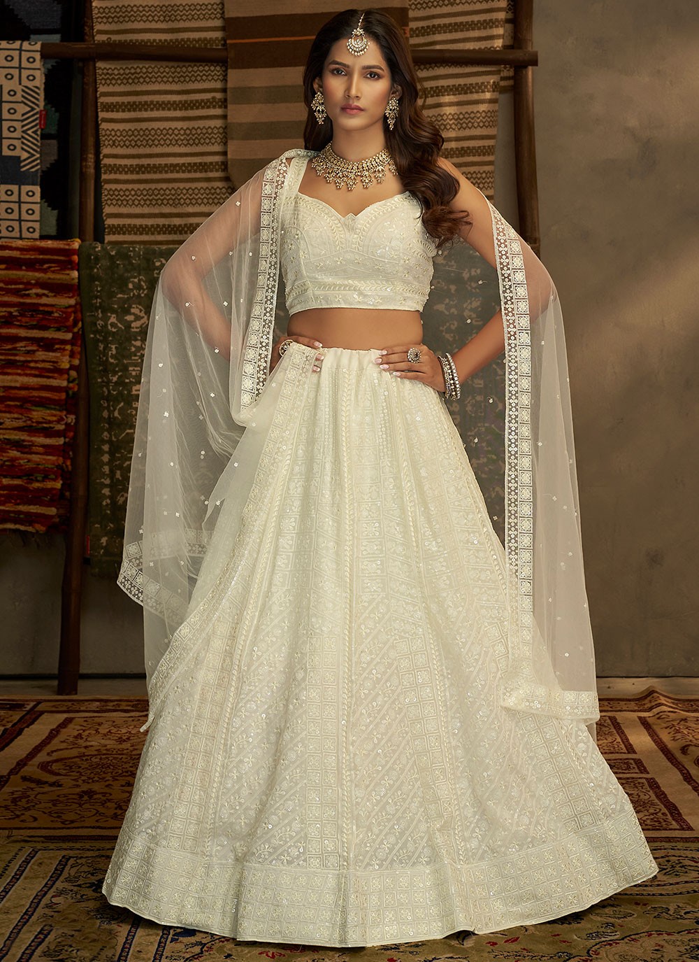 IVORY WHITE SHIMMERY LEHENGA SET WITH AN EMBROIDERED BLOUSE PAIRED WITH A  MATCHING DUPATTA AND SILVER HIGHLIGHTS. - Seasons India