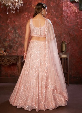 Conspicuous Pink Net Lehenga Choli with Embroidered and Sequins Work