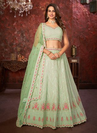 Exclusive Wedding Wear Net Fabric Sequins Work Lehenga Choli In Peach