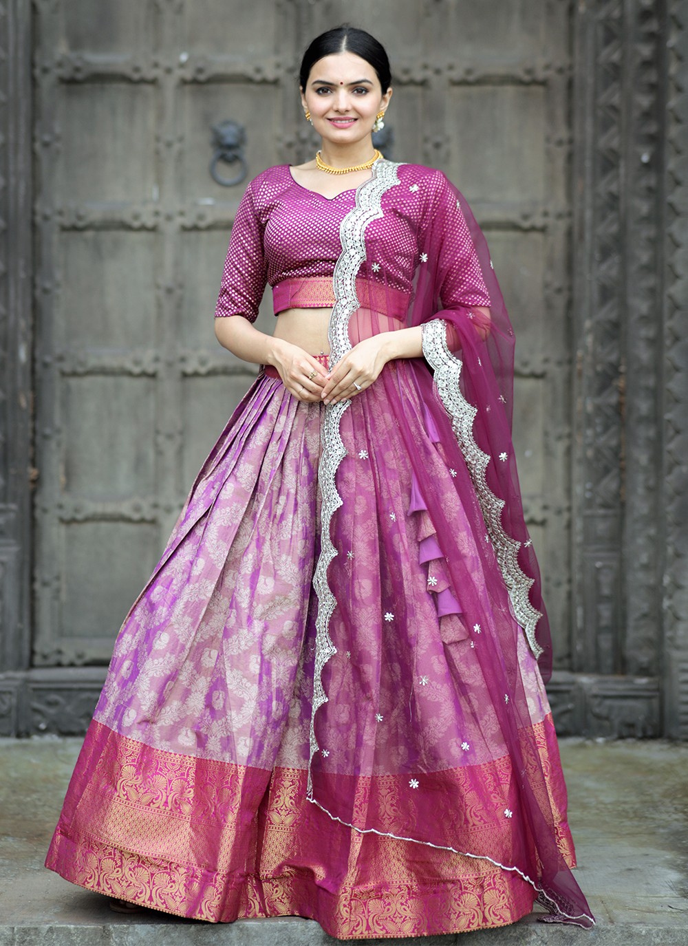Purple lehenga beautifully with a white floral dupatta | Indian bride  outfits, Purple lehenga, Indian fashion dresses