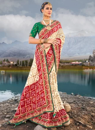 Suave Cream and Red Satin Designer Saree with Bandhej, Cut Dana, Embroidered, Mirror and Moti Work