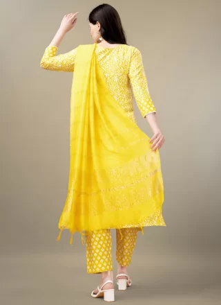 Dignified Yellow Rayon Salwar Suit with Embroidered and Print Work