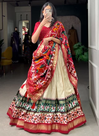 Exciting Off White Tussar Silk Lehenga Choli with Patola Print Work