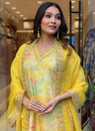 Fetching Yellow Muslin Readymade Salwar Suit with Embroidered and Print Work