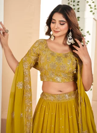 Mustard Faux Georgette Lehenga Choli with Embroidered and Sequins Work