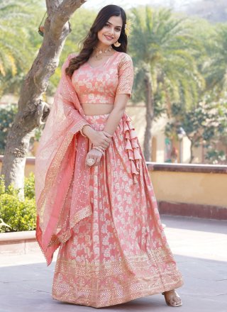 Outstanding Peach Jacquard Lehenga Choli with Embroidered and Sequins Work