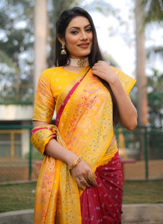 Rani and Yellow Kanjivaram Silk Weaving and Zari Work Bandhani Saree for Women