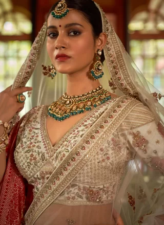 Cream Silk Lehenga Choli with Embroidered, Pearls, Sequins, Thread, Weaving and Zari Work