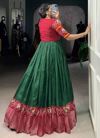 Fancy Fabric  Designer Gown with Patola Print and Weaving Work