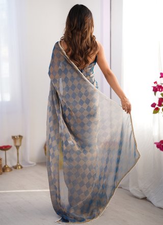 Fetching Blue Chiffon Trendy Saree with Lace and Woven Work