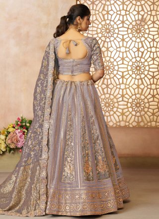 Mauve Net Embroidered, Stone, Thread, Weaving and Zari Work Lehenga Choli for Ceremonial