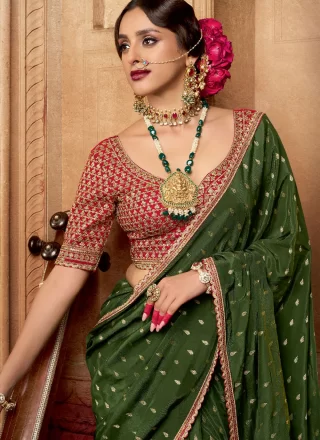Patch Border, Booti, Lace and Zari Work Pure Crepe Trendy Saree In Green
