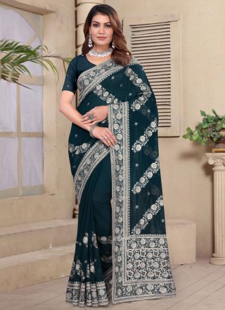 Perfect Morpeach and Teal Georgette Traditional Saree with Embroidered, Resham and Zari Work